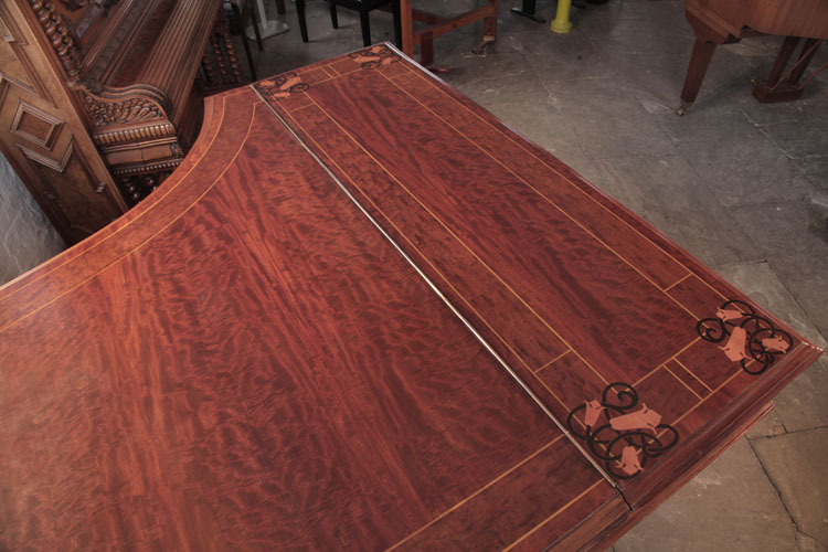 Bechstein figured mahogany lid bordered with satinwood stringing, inlaid with contrasting bellflowers and celtic knotwork motifs.
