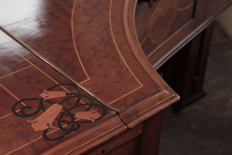 Figured mahogany piano lid inlaid with  stylised bellflowers, celtic knotwork and stringing in contrasting woods
