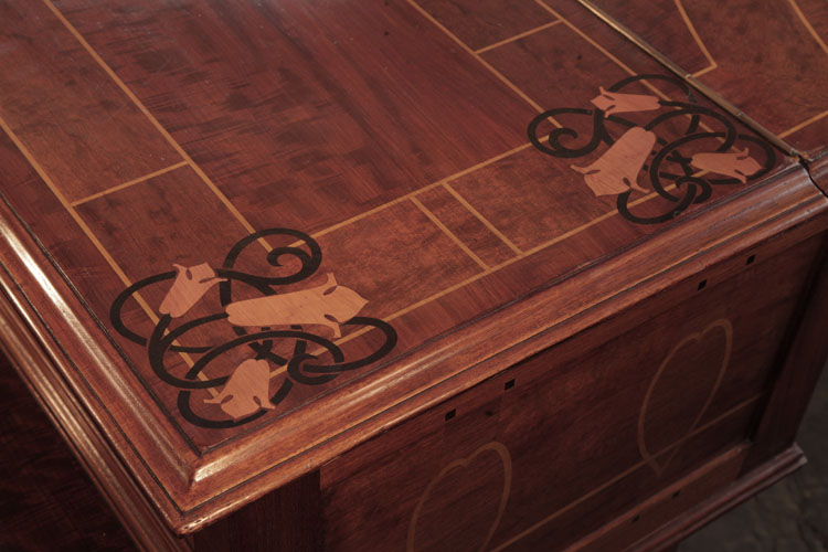Figured mahogany piano lid inlaid with  stylised bellflowers, celtic knotwork and stringing in contrasting woods
