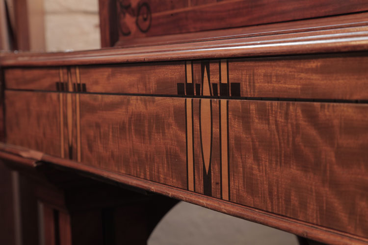 Piano fall inlay in a geometric design in contrasting woods
