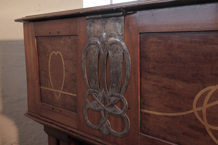 Inlaid side cabinet with a beaten copper hinge mount in a stylised heart and knot