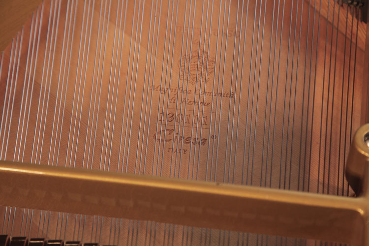 The soundboard has been replaced with a Ciresa soundboard