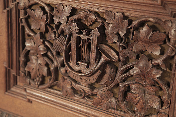 Biese Hof front panel carved with foliage and musical instruments in high relief