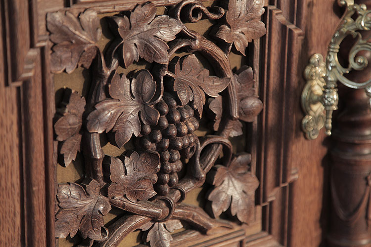 Biese Hof side panel carved with vine leaves and grapes in high relief