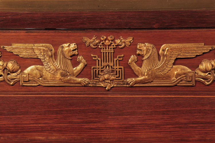 The front panel of the grand features gilted, Empire mount motifs. Bees fly around flowers, between two winged lions couchant 