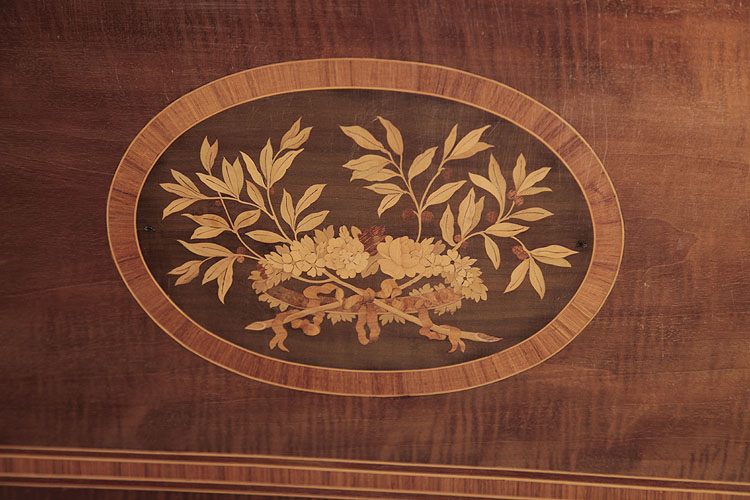Broadwood inlaid panel featuring a floral head dress and foliage
