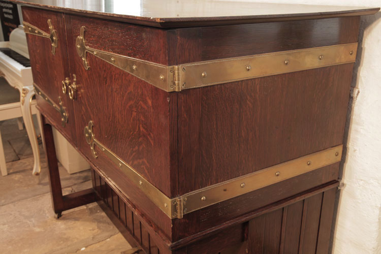 Broadwood studded brass strap hinges wrap around the cabinet