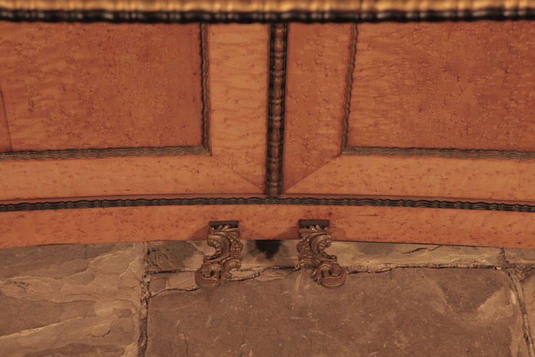 Chappell bowed cabinet base with book-matched bird's eye maple panels edged with black and gilt accents and ornate brass pedals 