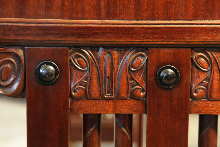 Carved detail on leg pediment