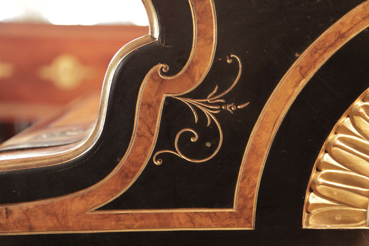 Gold stylised flowers and tendrils carved on piano cheek 