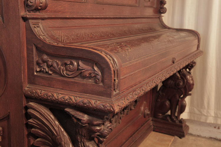 Francke rounded piano cheek carved with hibiscus and scrolling foliage