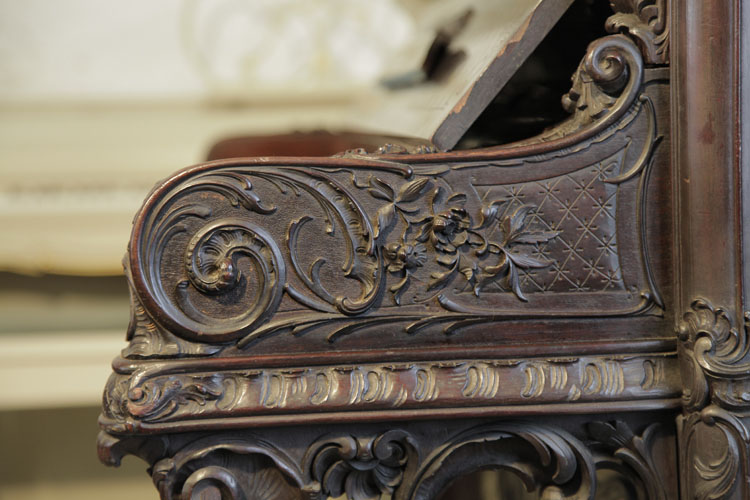 Francke intricately, carved piano cheek detail featuring latticework, scrolling acanthus and flowers
