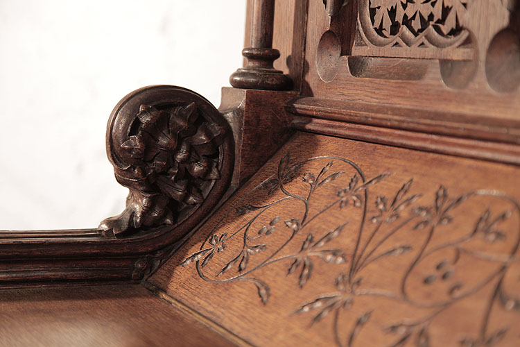 Gebruder Knake piano cheek featuring an ornately carved, floral rosette