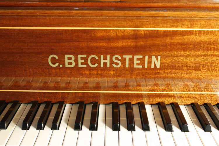 Bechstein name in brass on fall with satinwood stringing