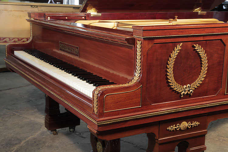 Ibach piano cheek with ormolu beading accents and a central laurel wreath