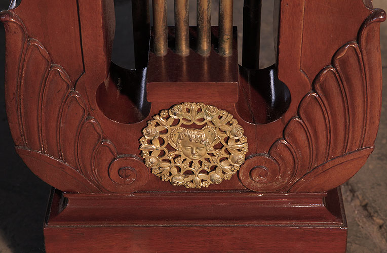 Ibach piano lyre ormolu mount depicting a head surrounded by roses and flowers in filigree circular motif