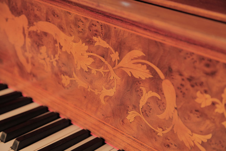 The piano fall is inlaid with hibiscus flowers and scrolling tendrils 