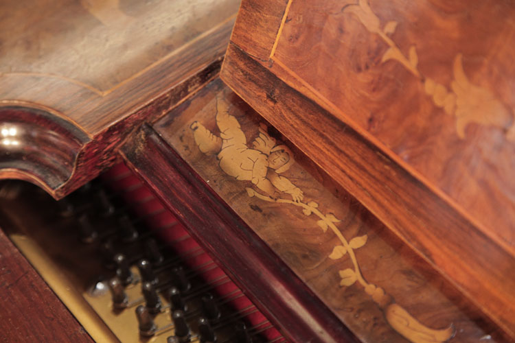 A floating cherub holds aloft a hibiscus tendril 