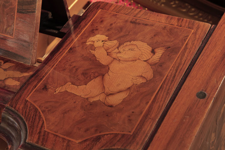 Detail of a winged cherub blowing a horn .