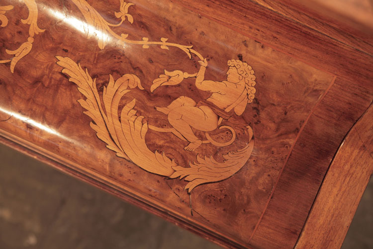 Lipp rounded piano cheek inlaid with winged cherubs , hibiscus flowers and tendrils