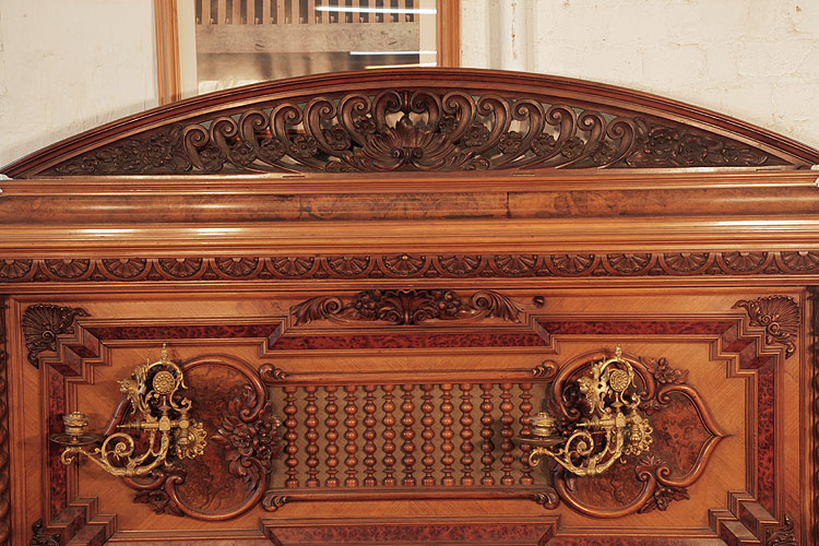 Pfaffe arcading featuring carved C-scrolls in high relief with a central foliar flourish 