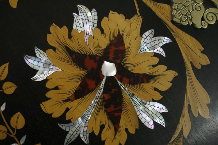 Detail of an inlaid hibiscus flower