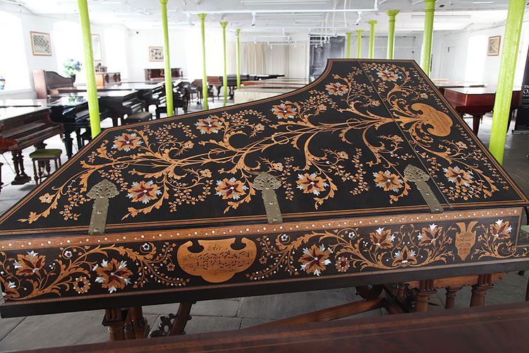The entire cabinet of this Broadwood grand piano is intricately inlaid