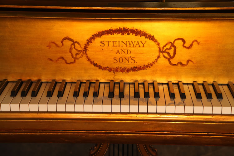 Steinway name on piano fall