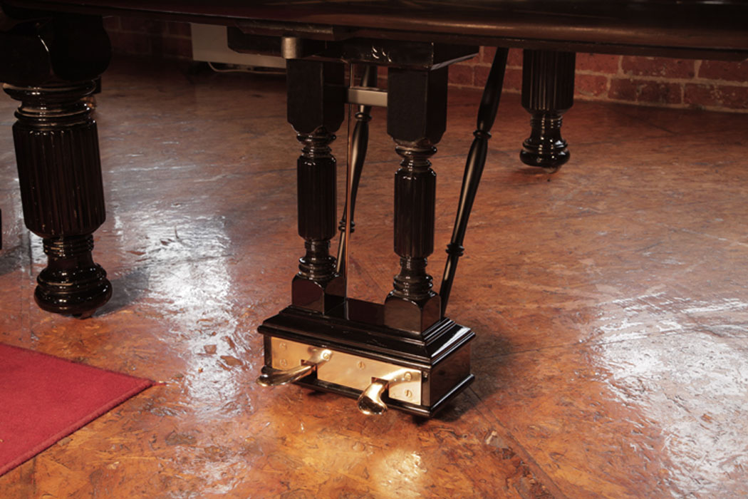 	Steinway two-pedal piano lyre with brass footplate. The lyre mimics the leg design with matching fluted spindles