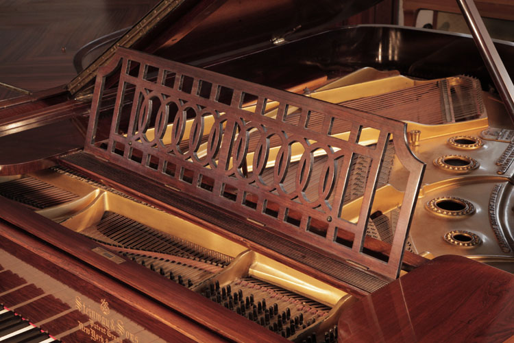 Steinway cut-out  piano music desk in an geometric design featuring interlocking ovals