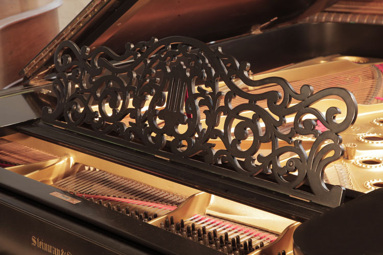 Steinway Model B piano music desk in an openwork arabesque design with central lyre motif