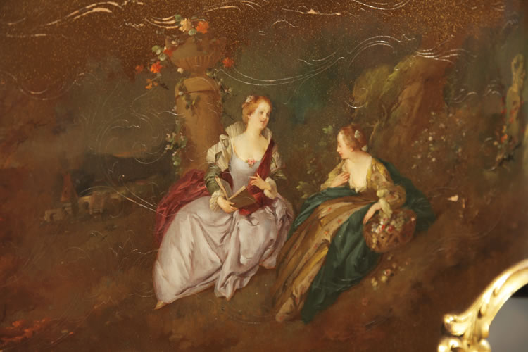 Detail of two ladies sitting outdoors discussing the contents of a book and gathering flowers in a basket 