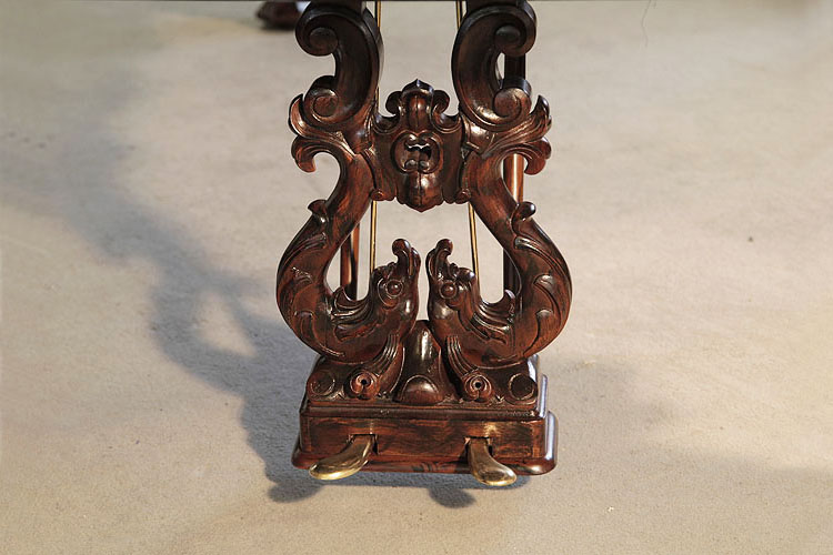 Steinway Centennial concert grand two-pedal piano lyre featuring carved fish, c-scrolls and a cartouche