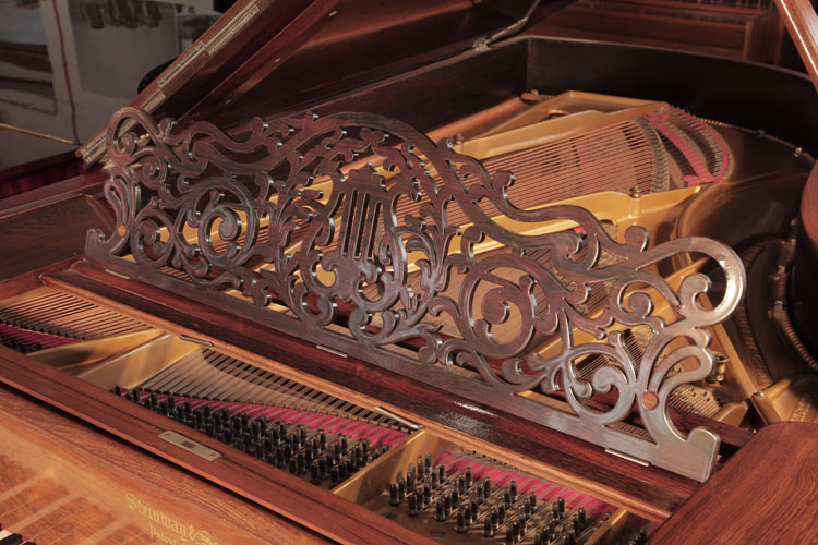 Steinway Style 1 grand music desk in an openwork filigree design of arabesques and a central lyre motif