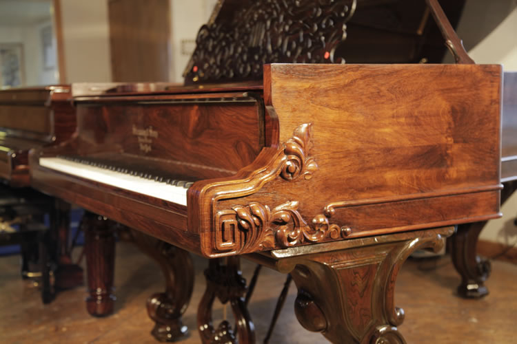 Steinway style 1 piano cheek with a carved Classical meander and scrolling acanthus foliage in high relief 