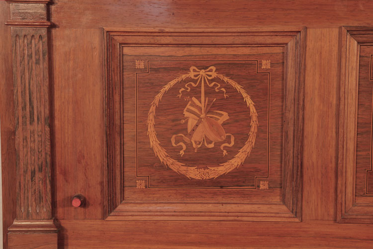 	
Steinway pilaster and side panel  inlaid with a circular wreath, tied with a bow and musical instuments