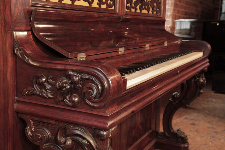 Steinway carved, scrolling piano cheek with a carved hibiscus flower