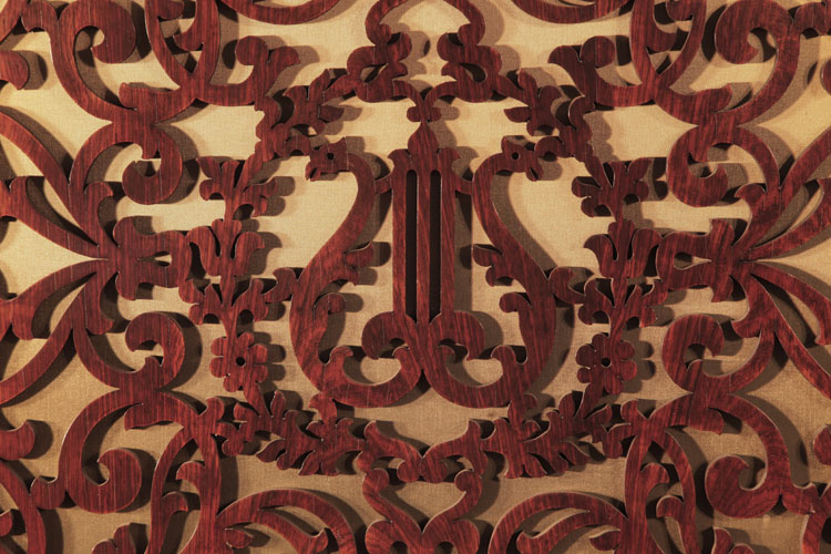 Steinway openwork front panel carved in an arabesque design with central lyre and wreath motif