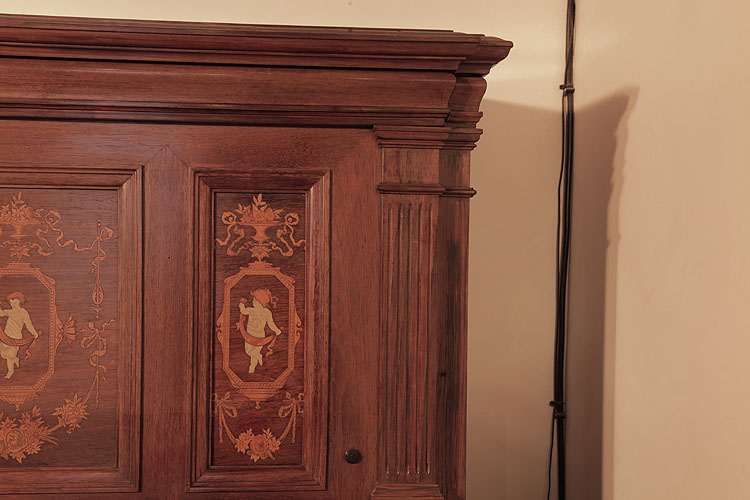 	Steinway pilaster and inlaid side panel of a child in swagged material, surrounded by an urn, ribbons and flowers