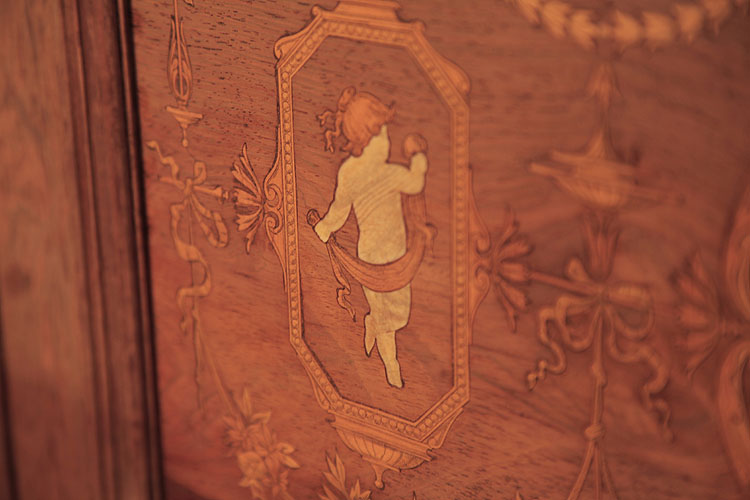 Detail of side panel inlaid with a dancing child draped in fabric