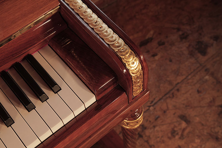 Steinway piano cheek with gold interlocking strapwork