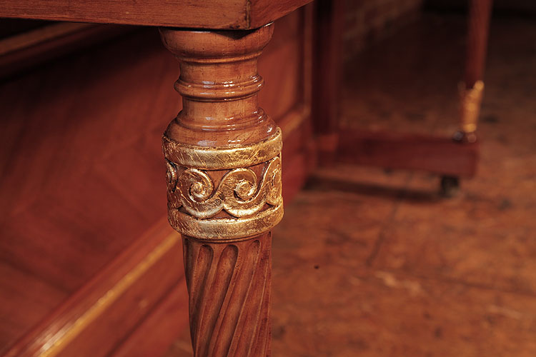 Steinway leg detail featuring rolling waves in gold