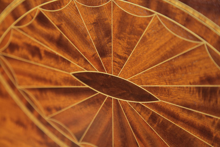 Weber front panel inlay detail featuring geometric forms in a variety of woods