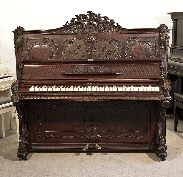 Rococo style, Francke upright piano for sale with a carved, mahogany case and reverse scroll legs.