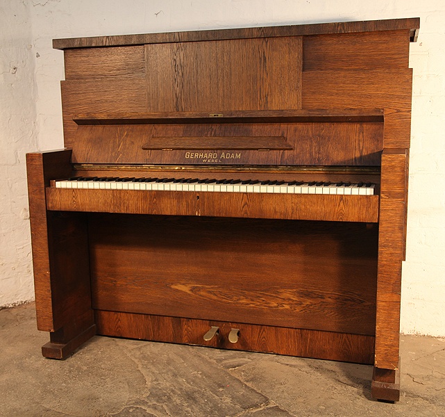 Brutalist style, Gerhard Adams upright piano with a polished,  oak case