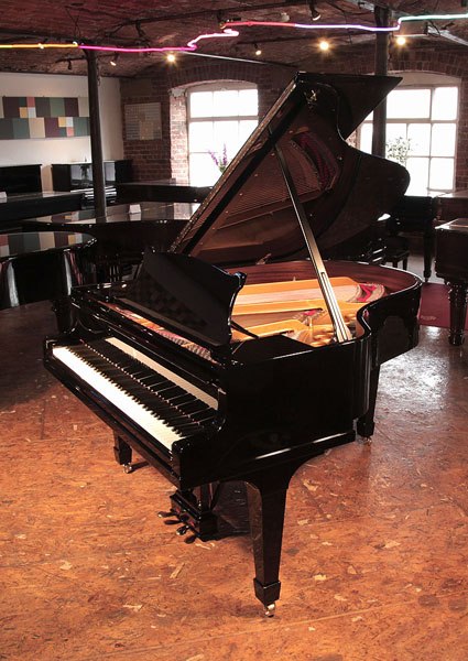 Rebuilt, 1932, Steinway Model M grand piano for sale with a black case and spade legs