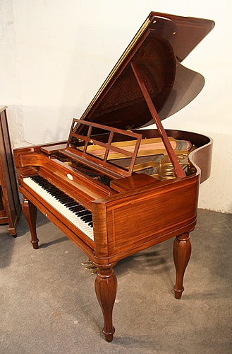 The Golden Age of Pianos. A Biedermeier style, 1926, Steinway Model M grand piano for sale with a french polished, mahogany case, stringing inlay and five baluster legs
