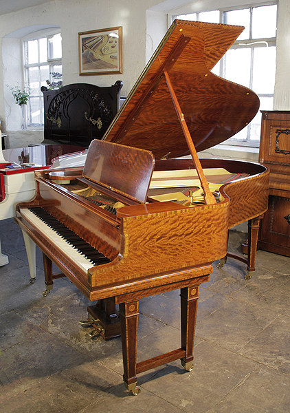 Stunning, 1906 Steinway Model O grand piano with a polished, satinwood case and gate legs. Entire cabinet inlaid with boxwood stringing and crossbanding accents. Piano has an eighty-eight note keyboard and a two-pedal lyre