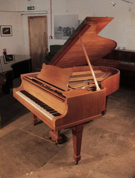 Reconditioned 1932, Steinway Model O grand piano for sale with a satin, walnut case and spade legs. Piano has an eighty-eight note keyboard and a two-pedal lyre.  