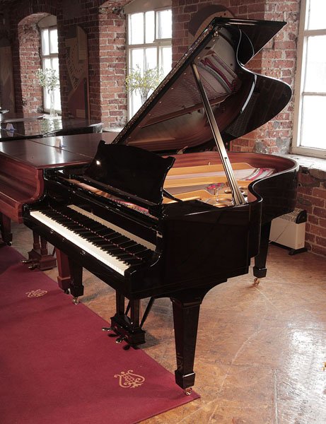 Rebuilt, 1969, Steinway Model O grand piano with a black case and spade legs. Piano has an eighty-eight note keyboard and a two-pedal lyre. 